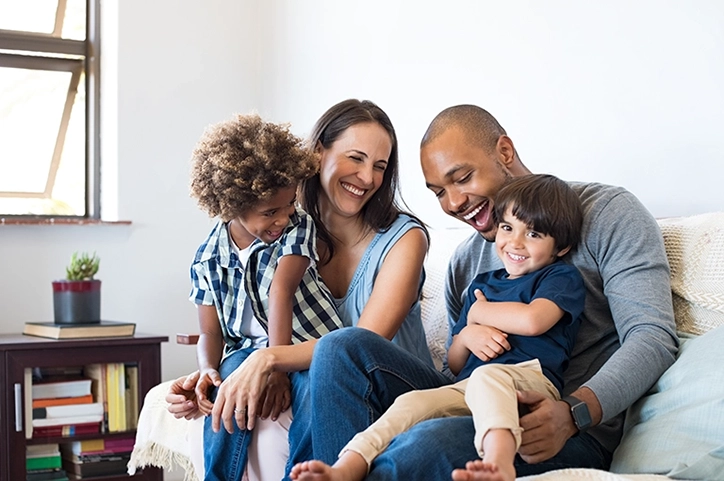 Diverse Family Sharing Laughs With Eachother