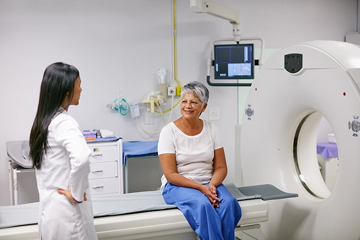 CT Technologist Explaining CT Arthrogram To Patient