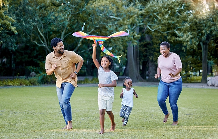 Family Having Fun In The Park