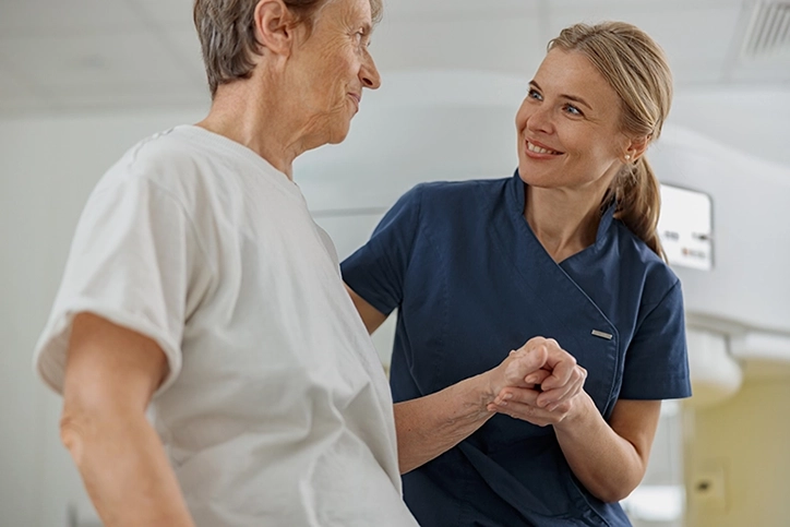 MRI Technologist Comforting Patient Before MR Angiogram