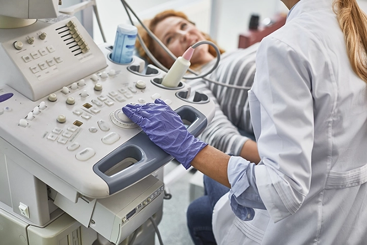 Patient Smiling At Ultrasound Technologist