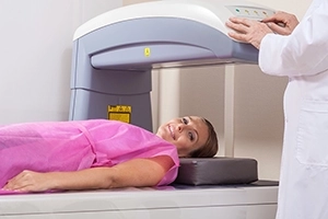 Woman Smiling Before Her DEXA Scan Starts