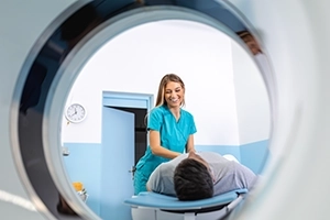 CT Technologist Smiling At Patient During Low Dose CT Lung Screening