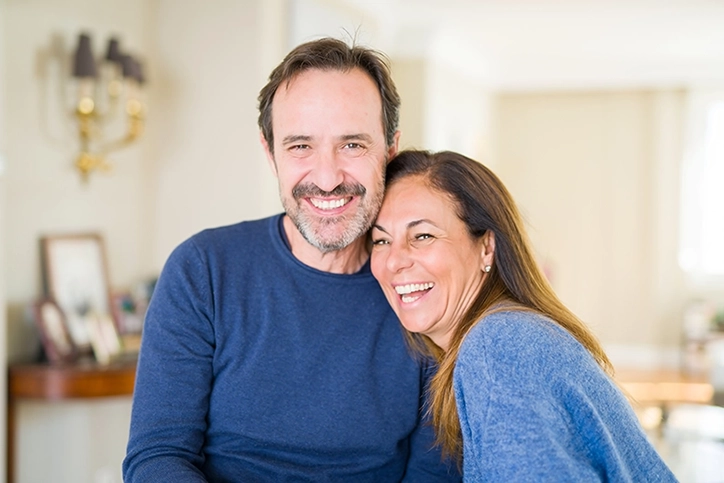 Couple Smiling In Their Home