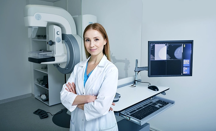 Mammography Technologist In Exam Room