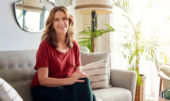 Woman Sitting On Her Couch