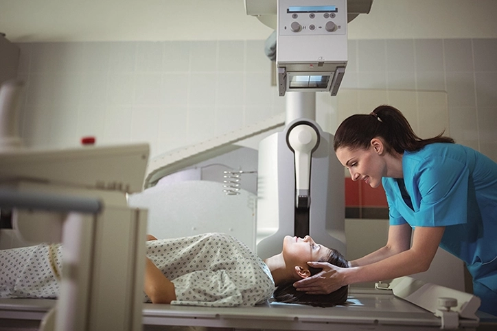 X Ray Technologist Positioning Patient For Head X-Rays