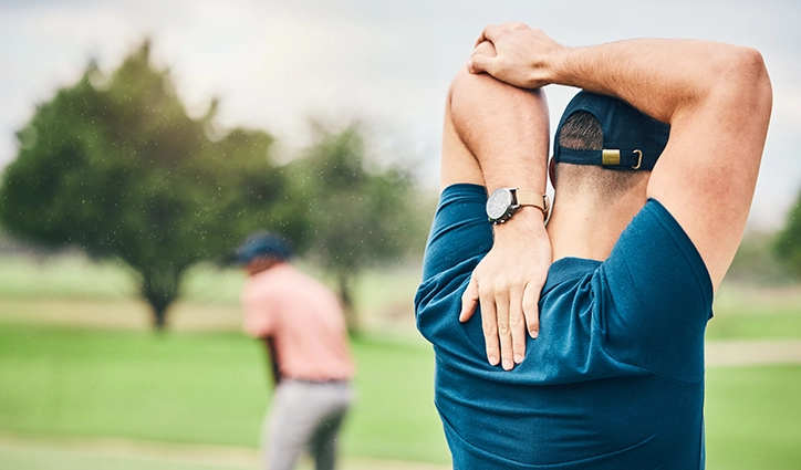 Young Golfer Experiencing Back Tightness