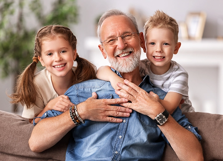 Grandpa Smiling With His Grandchildren