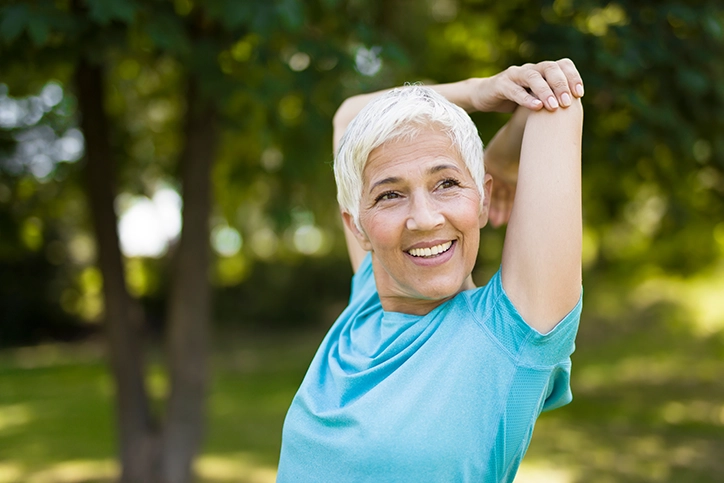 Woman Stretching Her Back After Exercising