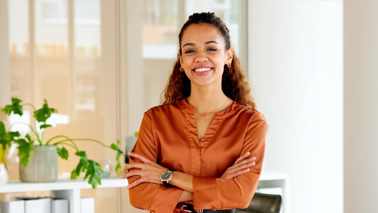 Woman Of Screening Age Smiling And Discussing Importance Of Early Detection