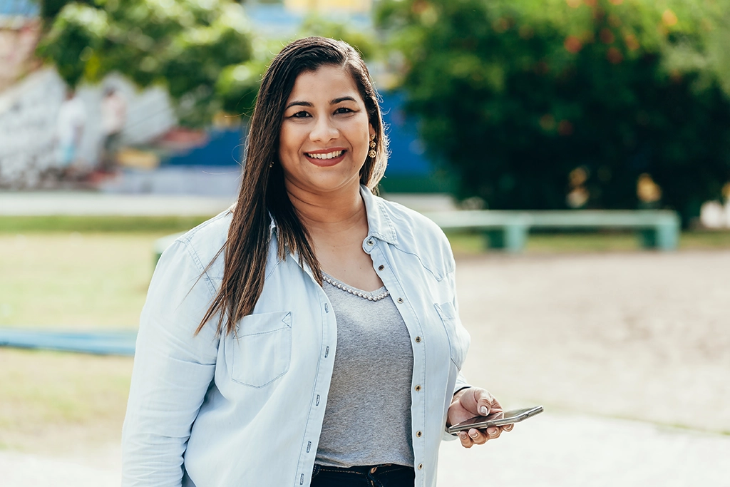 Woman With Dense Breast Tissue Smiling In A Park